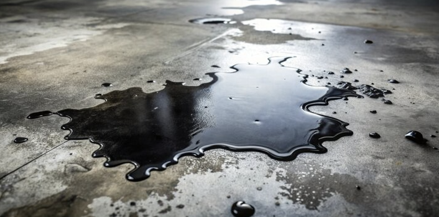Close-up of sealed concrete resisting oil and water